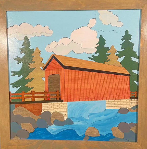 Framed wood quilt of a covered bridge
