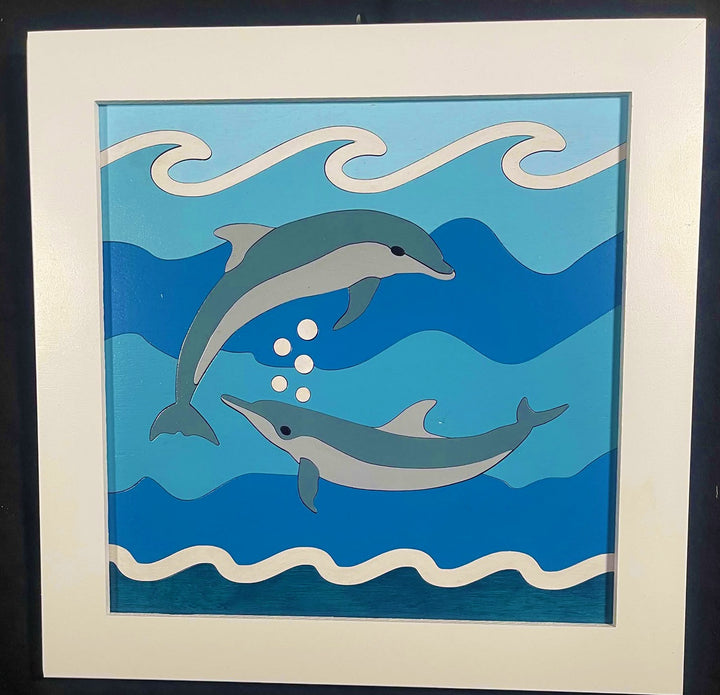 Framed wood quilt of a dolphin