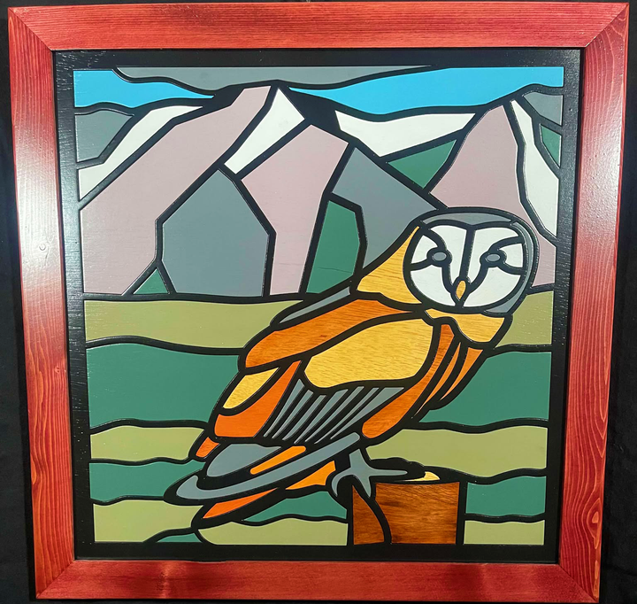 Wood framed quilt of an owl